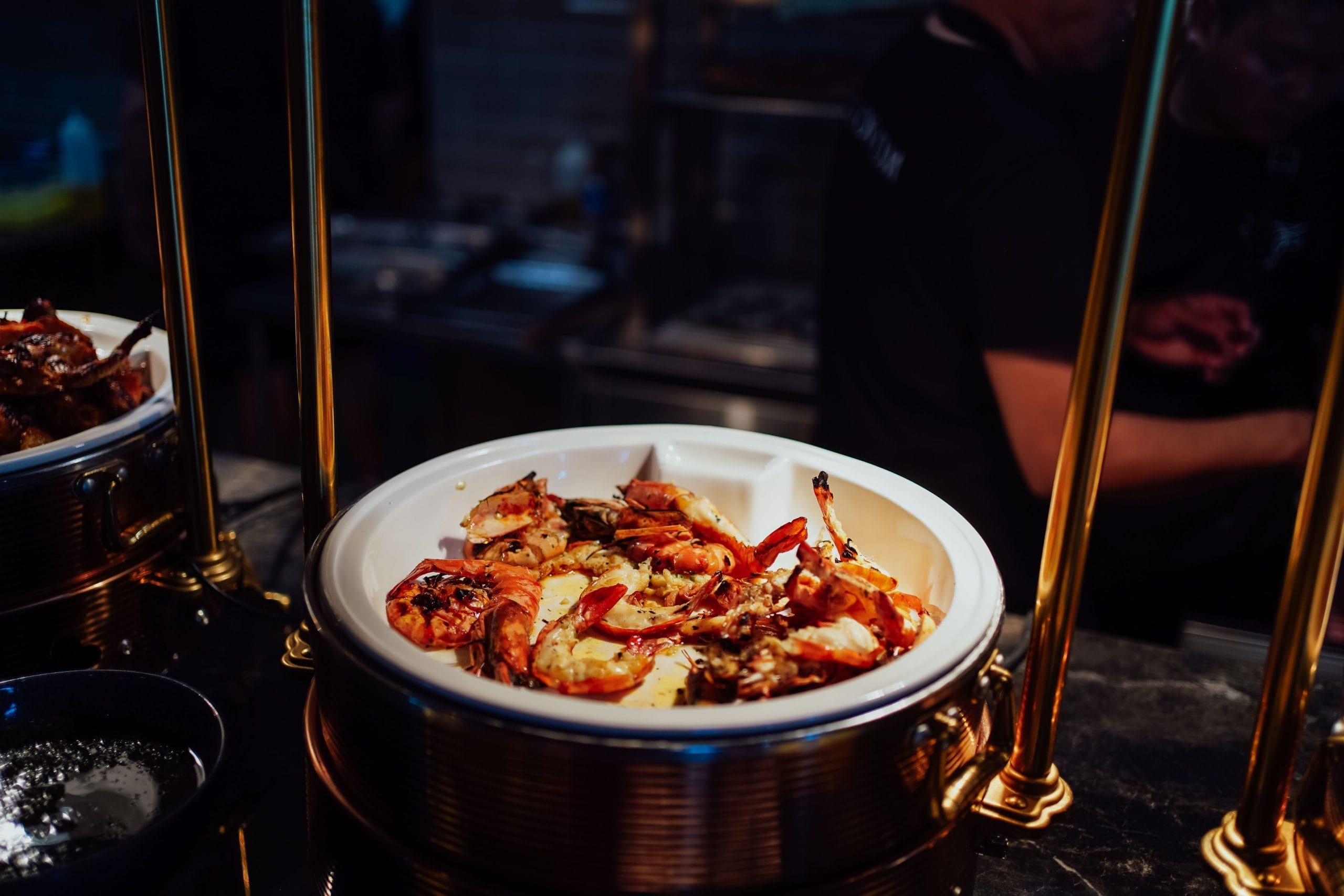 Butterfly prawns served in a buffet style at a private gathering