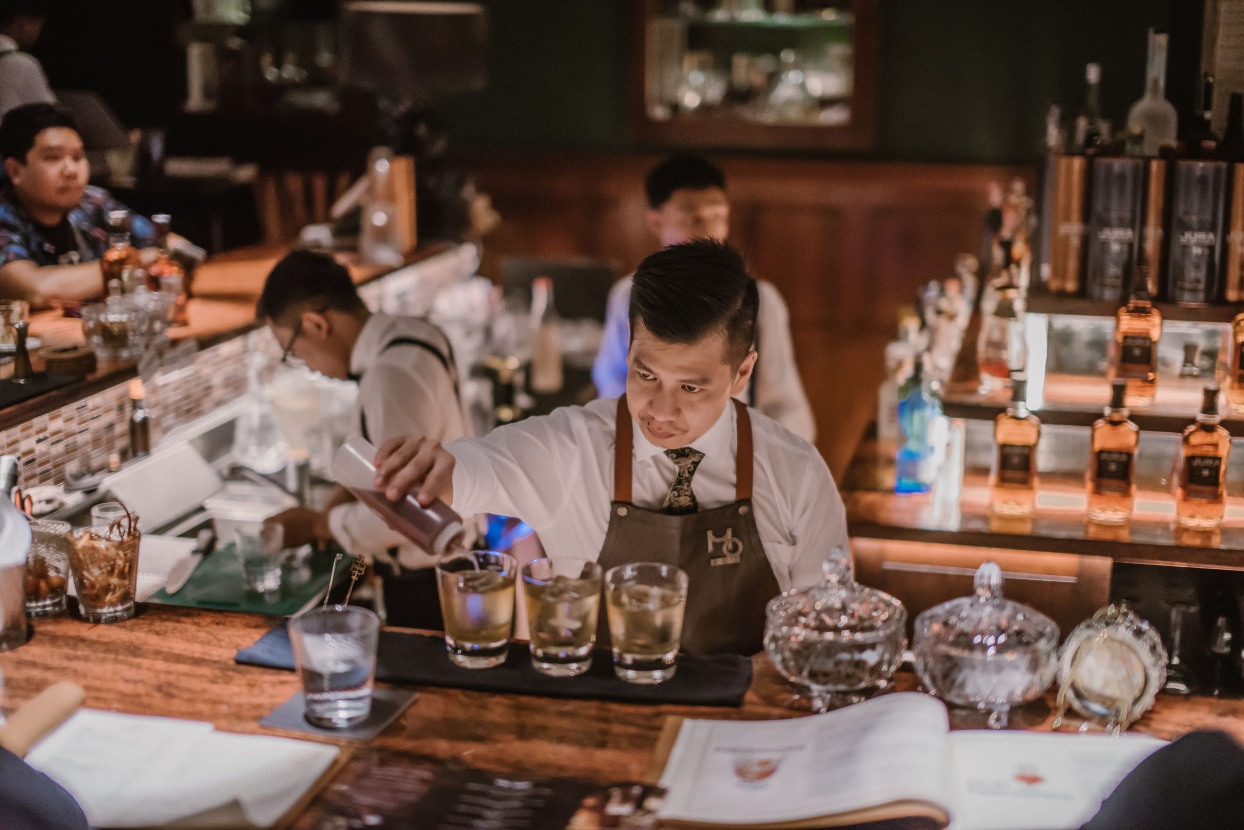 A Bali bartender hire of two bartenders preparing and serving drinks