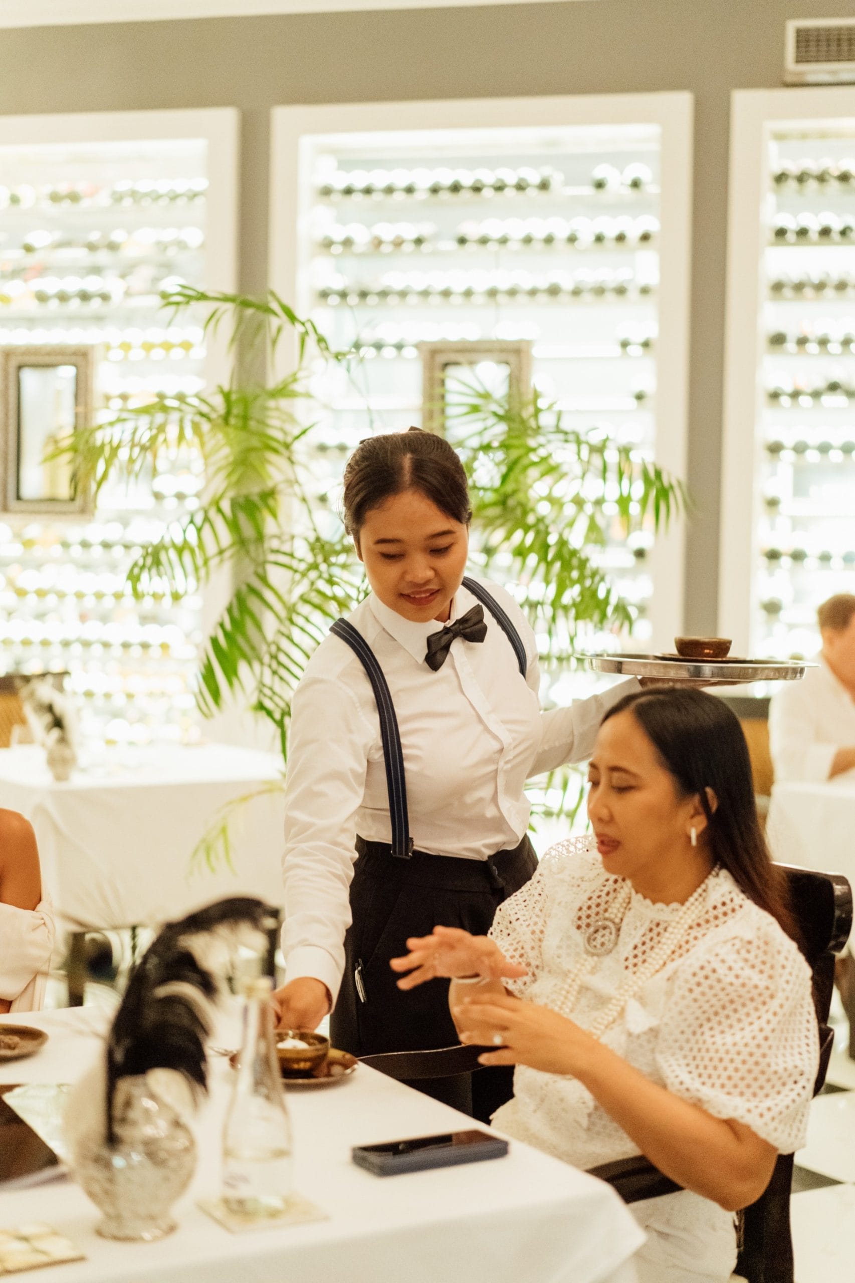 A Bali private chef serving a guest at an event