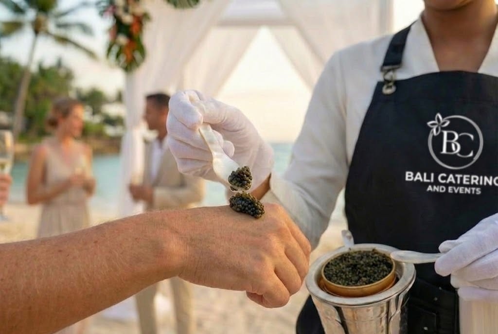 A waitstaff serving cavier at an event in Bali