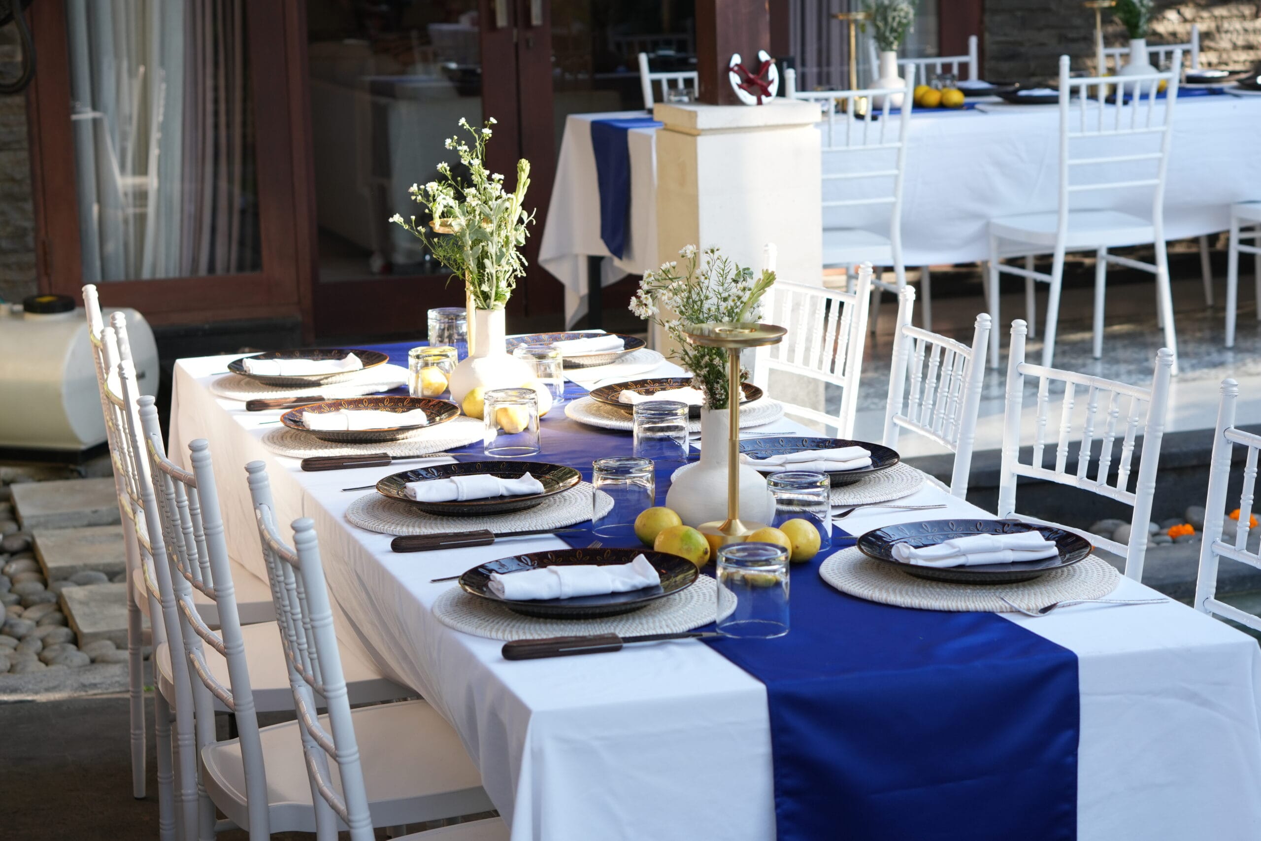 A table set up with beautiful plates and decorations for a catering event in Bali