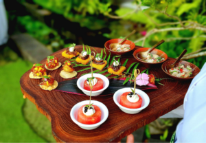 A variety of snacks being served by a caterer